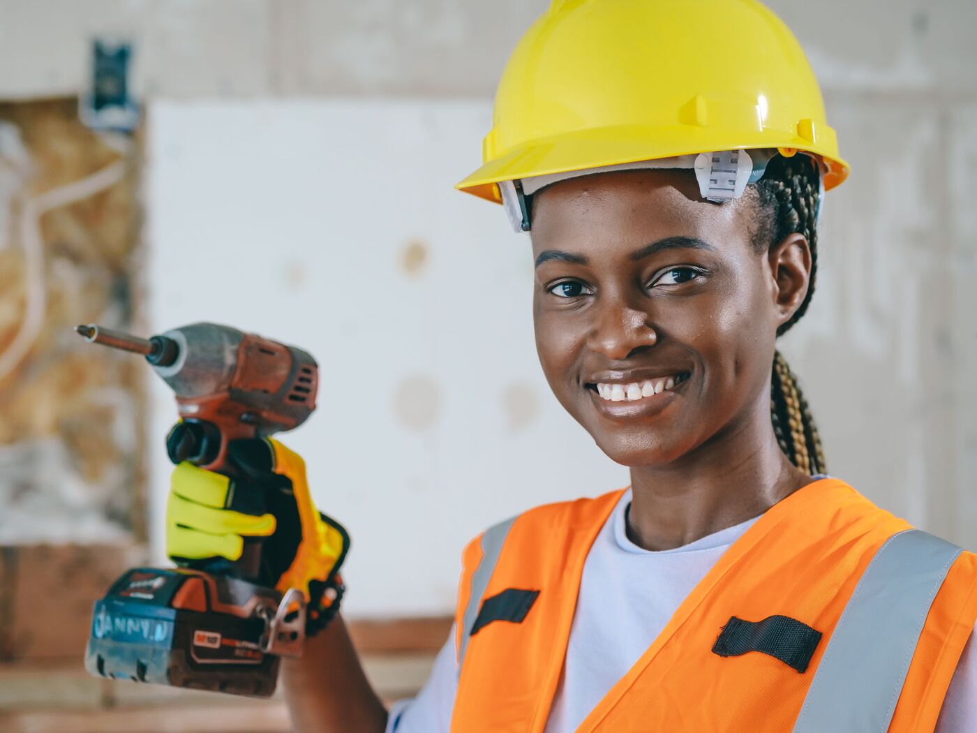 A smiling Oakwright fitter holding a cordless drill